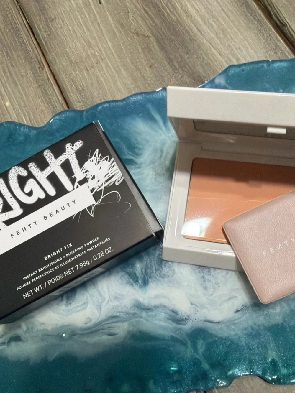 Fenty Beauty Compact bright fix with blurring effect in peach